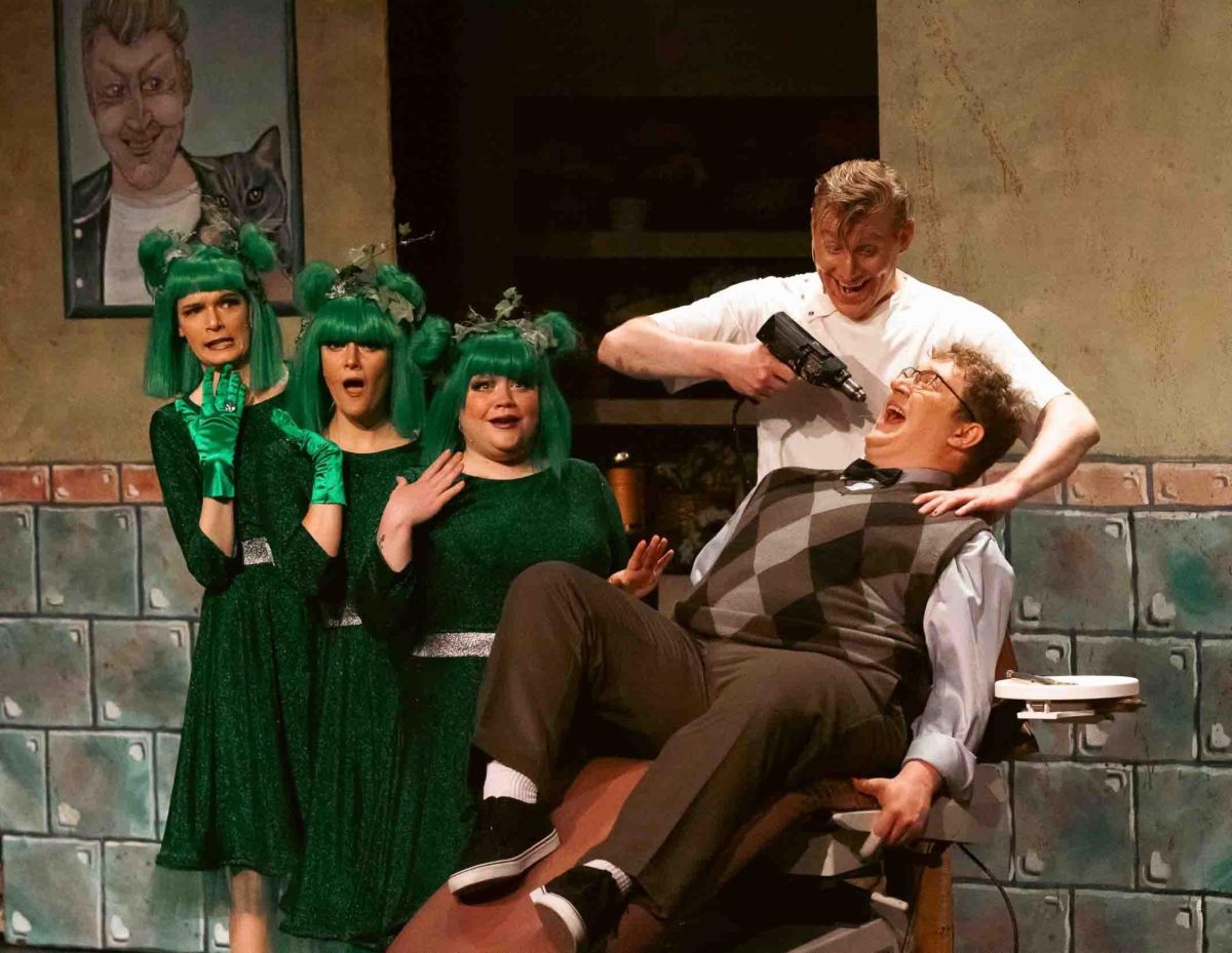 Deranged dentist Orin Scrivello, played by local actor Andrew Agner-Nichols, upper right, attacks Seymour Krelborn, played by local actor Ethan Keller, lower right, in Theatre AACC's production of 
