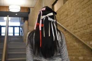 Women students say wearing bows—an international trend—is an expression of their femininity.