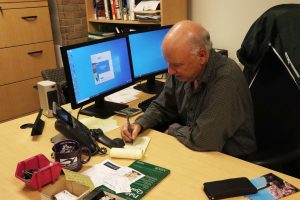 A March survey of Anne Arundel County residents reveals mixed opinions on President Trump’s government downsizing. Shown, political science professor Dan Nataf, who conducted a survey that asked about AI use.
