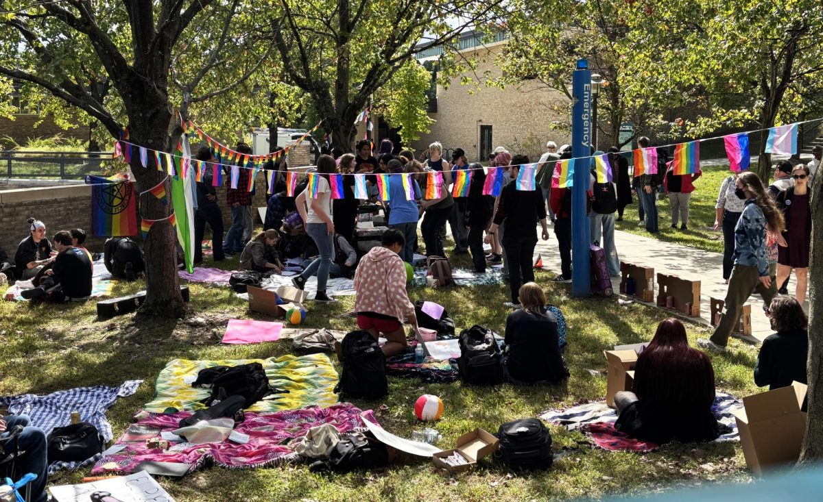A few dozen students spent Thursday afternoon staging a peaceful sit-in as a protest to an extremist rally on campus earlier in the week.
