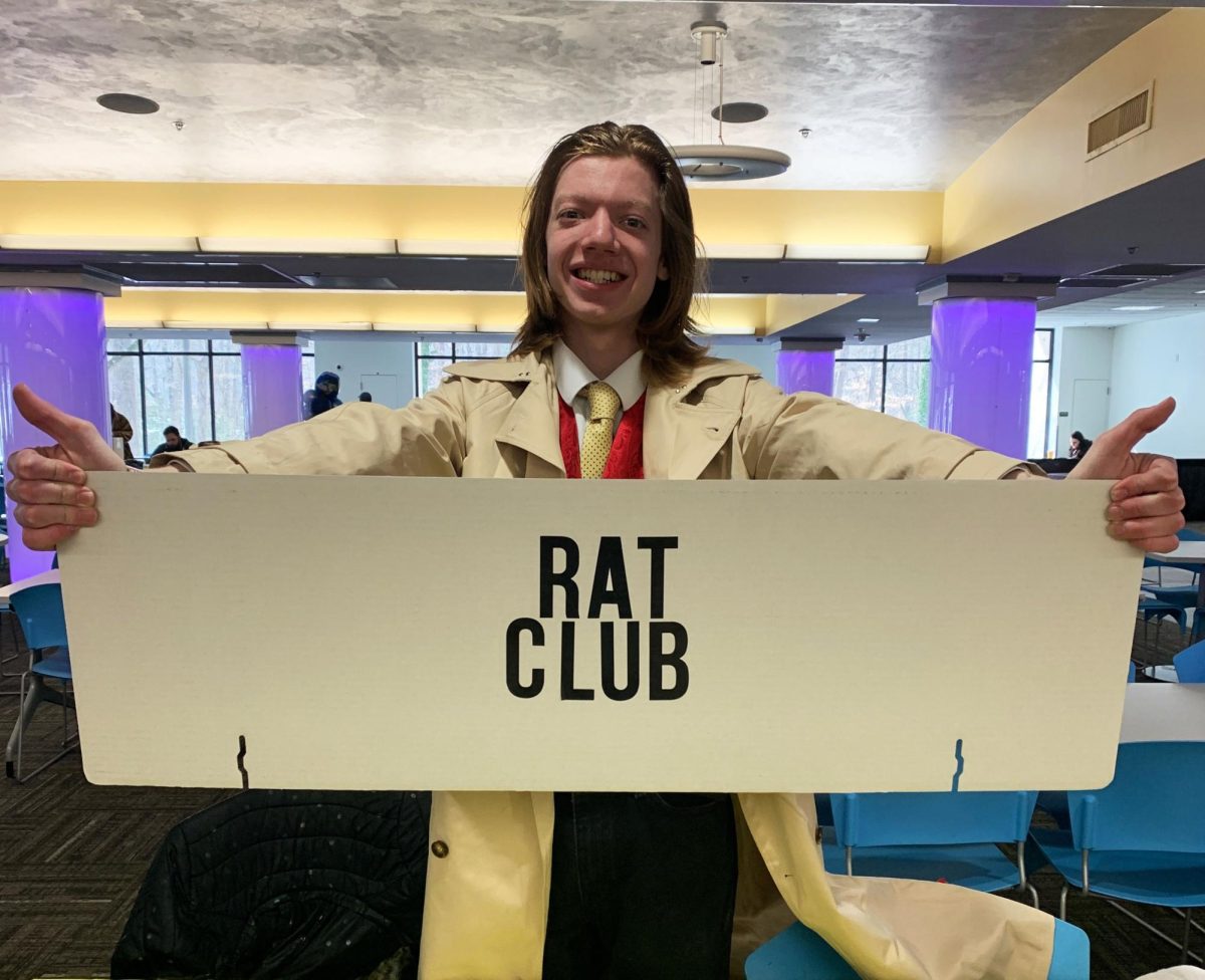 R.A.T Club president Nicholas Taylor holds up club sign.