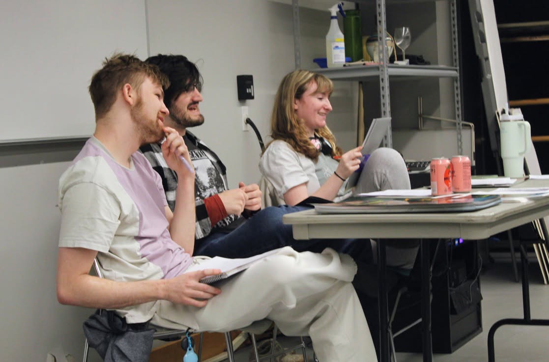 Improv players, from left, Allie Hunt, Jason Kalshoven and Jack Willis, observe other performers as they practice their skits for a spring show.